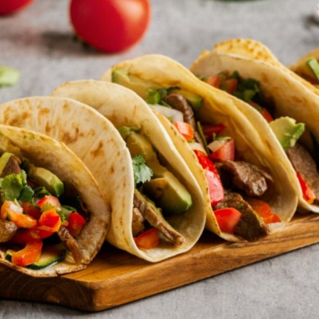 Prepare some tasty Tex Mex tacos, authentic Mexican food.