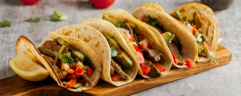 Prepare some tasty Tex Mex tacos, authentic Mexican food.